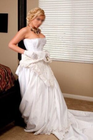 blonde Edinburgh escort in wedding dress