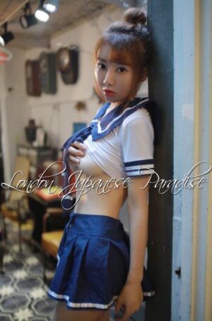 Amoko Japanese Escort in Victoria riding her top up and cupping her breasts