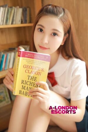 Gloria Korean Bond Street Escort reading a book