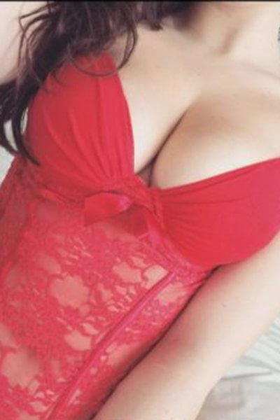 closeup of breasts in a tight red bodice