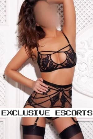 brunette Brighton escort modelling for the camera