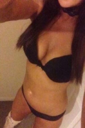 close up of Birmingham escorts tanned breasts