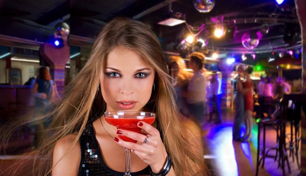 sexy chick drinking a cocktail