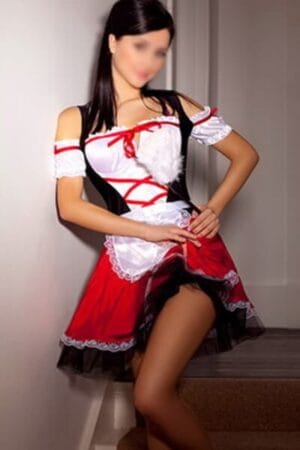 Dublin escort poses in German barmaid outfit