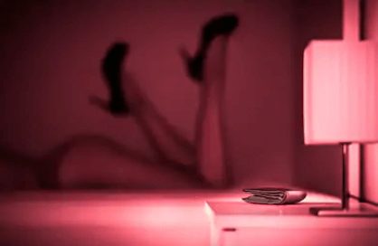 legs show in pink lighting