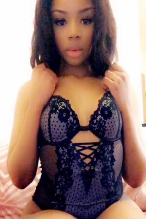 ebony Edinburgh escort holding her breasts