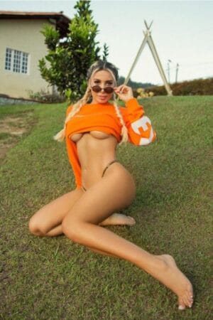 Johana Busty Russian London Escort wearing orange tshirt