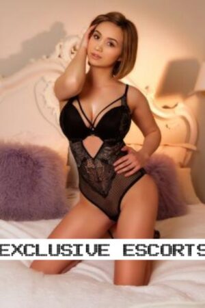Becky Beautiful Brunette London Escort in a black bodice