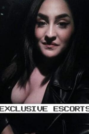 Brina Sexy Petite London Escort in a leather jacket