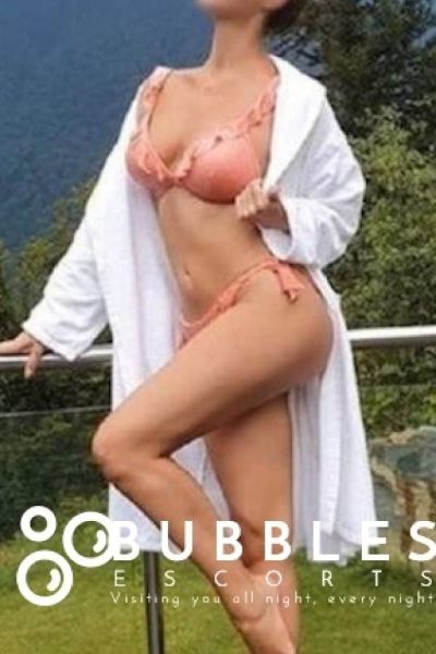 Madelyn Young European Escort in London wearing a robe