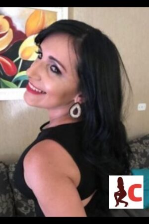 black haired Inverness escort smiling and modelling