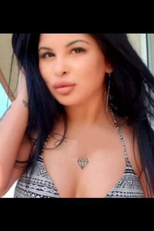 pouting Doncaster escort in grey bikini