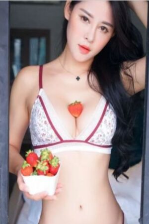 Asian Gloucester escort with strawberry in her cleavage