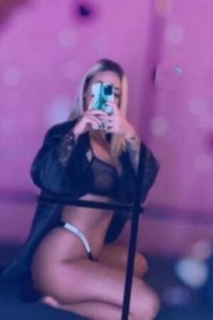 Wakefield escort in black robe taking a selfie