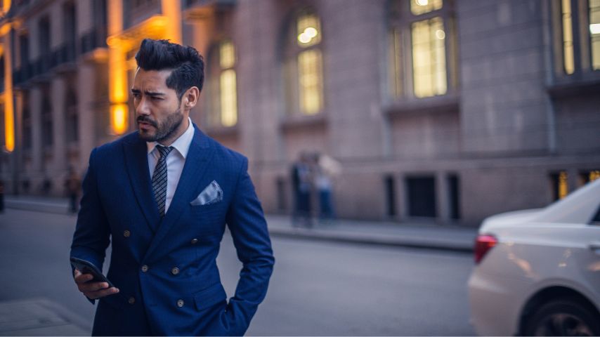 Man in suit with mobile blog post