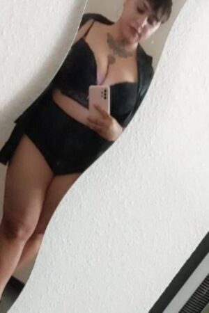 Curvy Blackpool escort with a neck tattoo