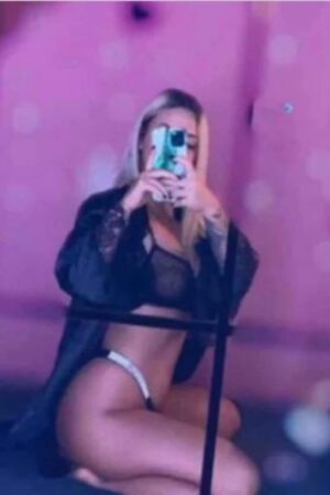 Brighton escort in robe taking selfie in robe