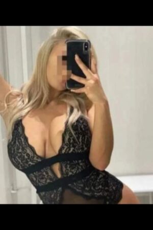 busty Aldershot escort in bustier taking selfie