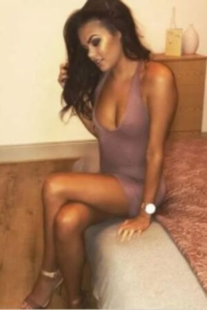 Outcall Middlesbrough escort sat on her bed