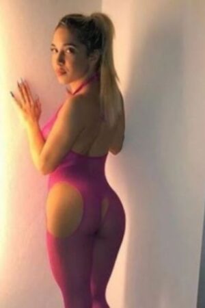 blonde Northampton escort wearing revealing pink lingerie