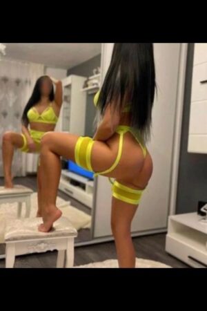 Walsall escort posing in neon yellow lingerie