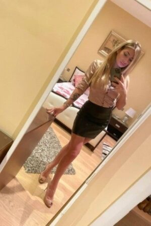 Striptease London Escort in a professional outfit