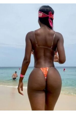 Belfast escort at beach wearing a bandana