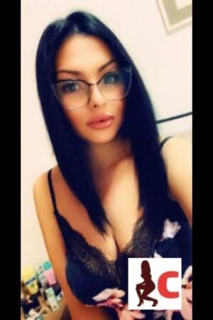 busty brunette Tyrone escort wearing glasses
