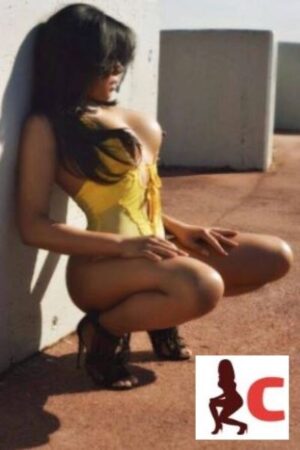 Derry escort in yellow posing outdoors