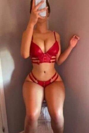 busty Wrexham escort in red leather lingerie