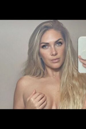 mature Carmarthenshire escort cupping her breast