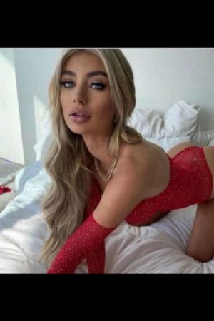 stunning blonde escort in red