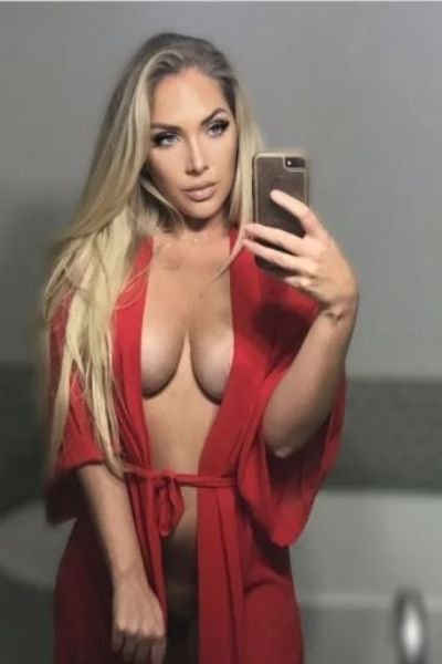 mature Carmarthenshire escort in a red robe