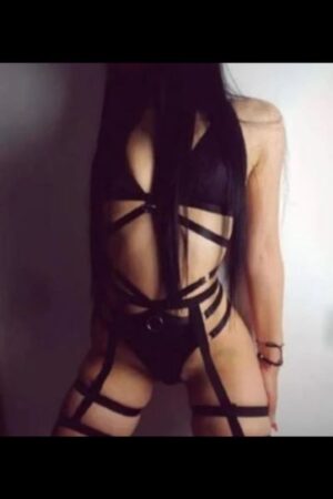 dark haired Canterbury escort in strappy outfit