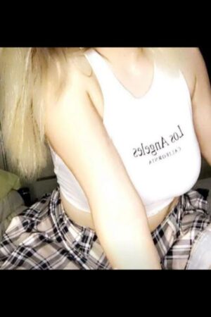 busty blonde Canterbury escort in LA shirt