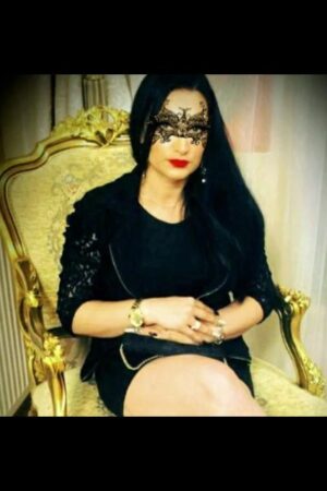 masked companion in fancy chair