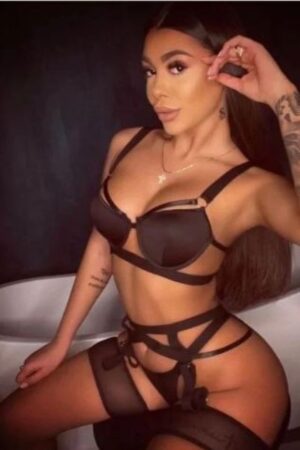 fit tanned Chester escort with arm tattoos
