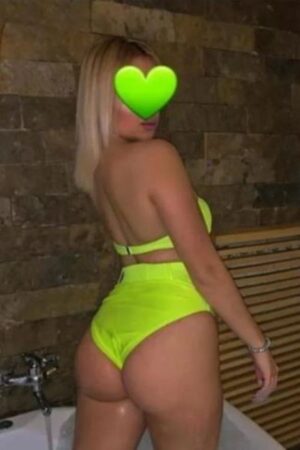 Sexy blonde Coventry escort in a yellow bikini