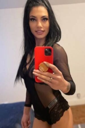 Mel Dark Haired Petite Escort taking selfie