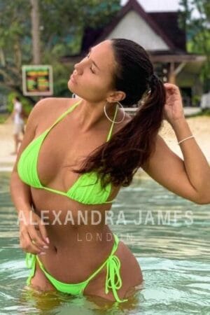 Andreea Young Brunette London Escort in lime green bikini