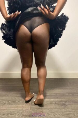 Ebony Escort in Essex showing her bum