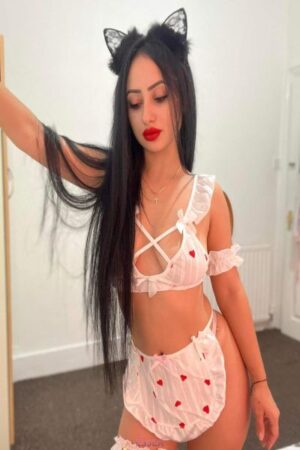 Brunette Escort in a love heart outfit