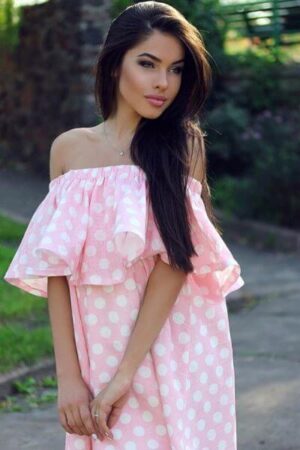 Laura Petite Young Escort in London in a over sized pink dress