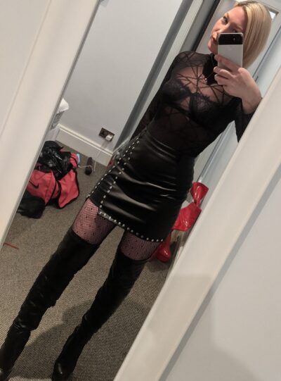 Miss Nee takes a selfie in a leather outfit