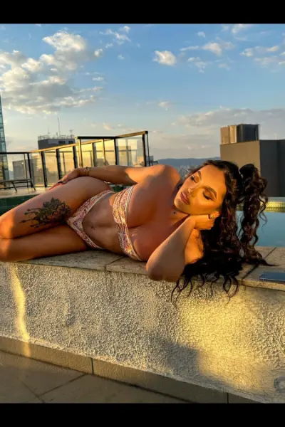Miss Colucci High Class laid on a rooftop