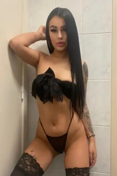 Young sexy Bridgend escort wearing a black bow