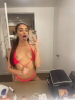 Petite breasted escort taking a selfie