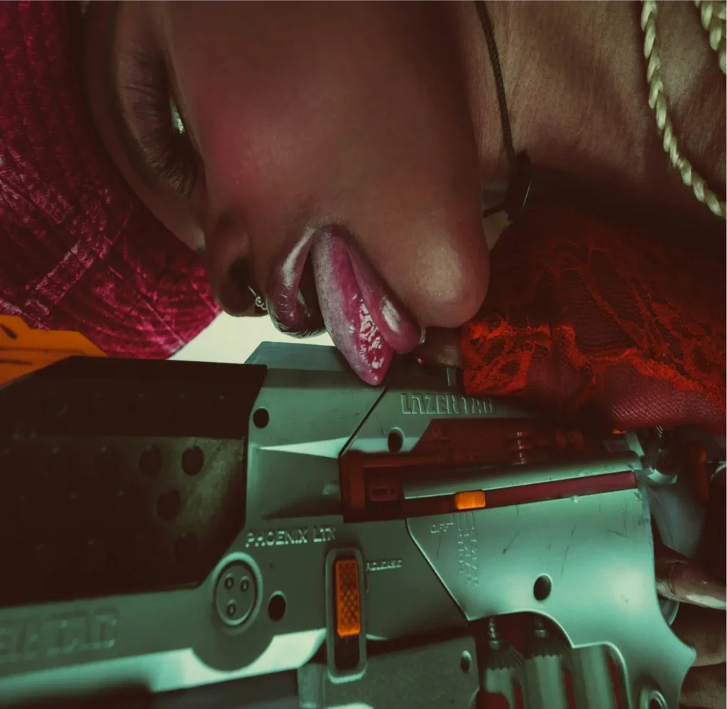Ebony woman licking her video recorder