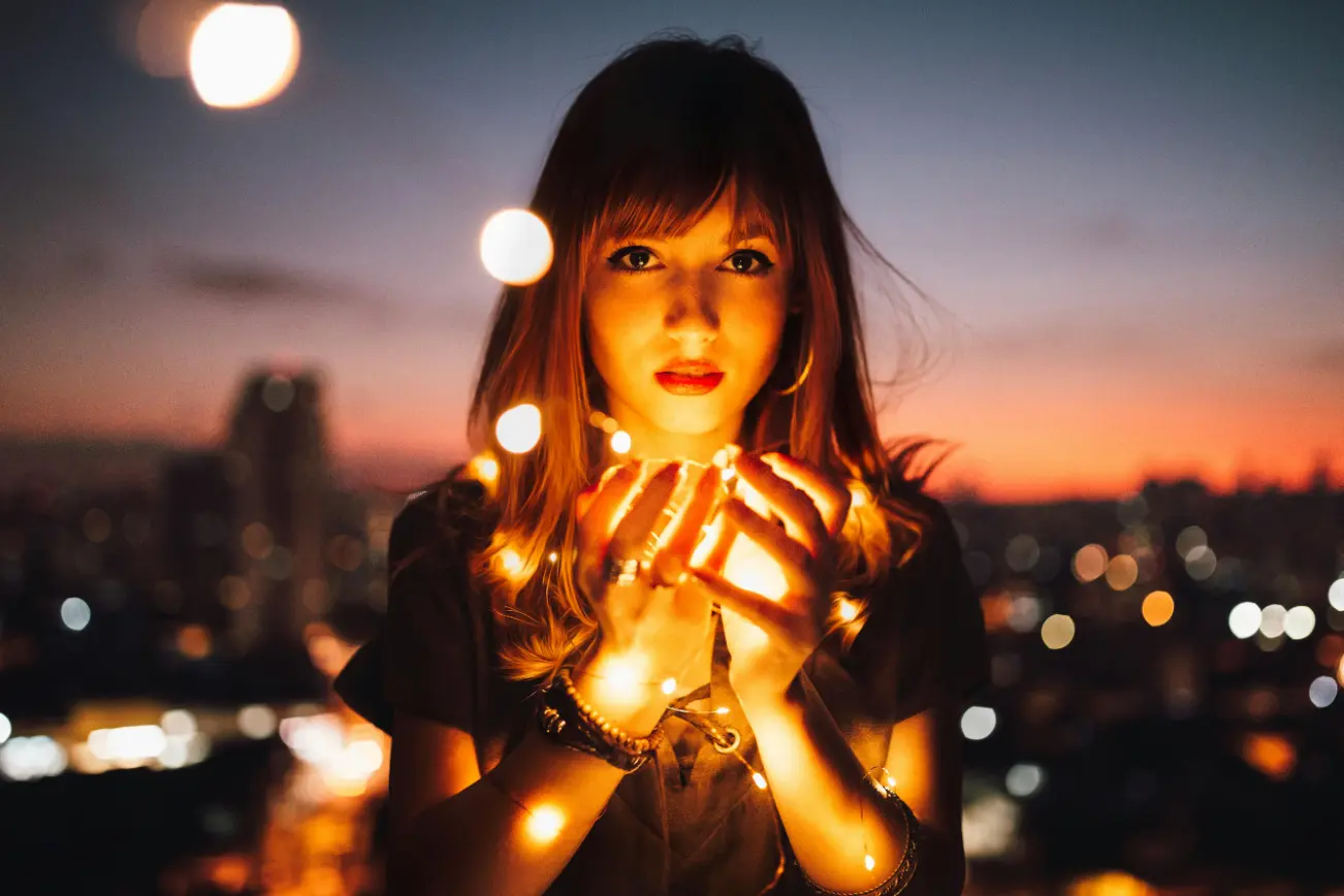 Manchester escort holding fairy lights