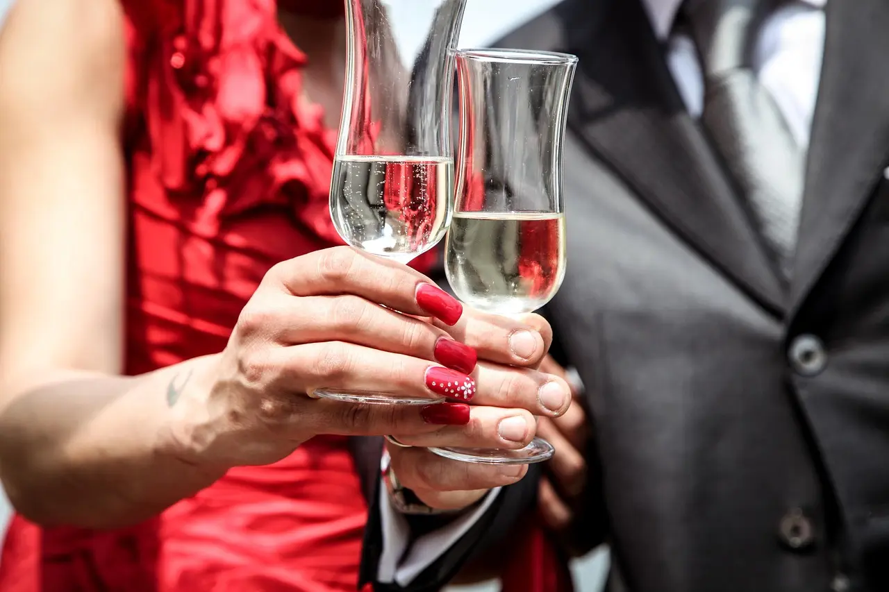 Man and Newport escort drinking Champagne